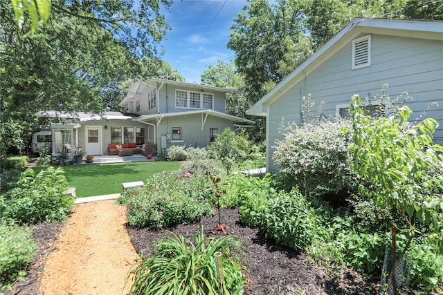 211 N Waddill St, Mckinney, TX 75069 - back of house with an outdoor hangout area, a lawn, and a patio