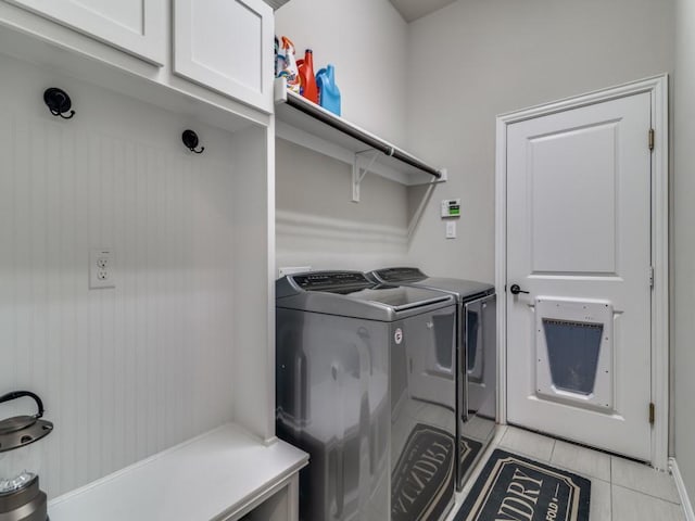 2201 Mountain Creek Ct, Wylie, TX 75098 - laundry room with cabinet space, washer and clothes dryer, and light tile patterned floors