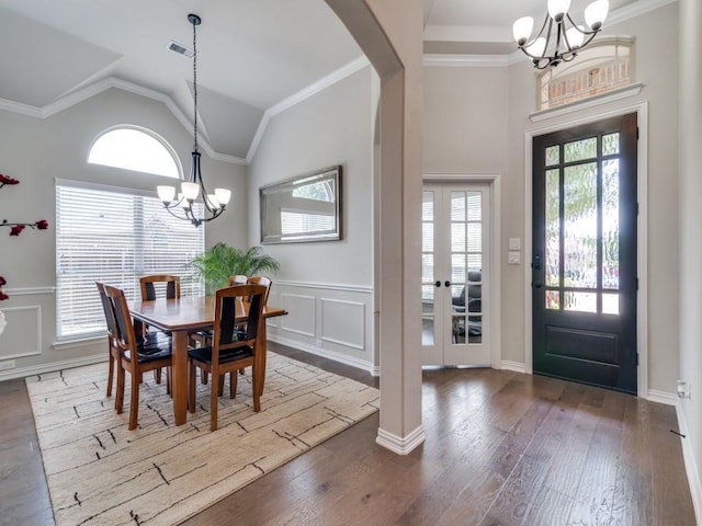 2201 Mountain Creek Ct, Wylie, TX 75098 - dining area with a chandelier, arched walkways, wood finished floors, french doors, and vaulted ceiling