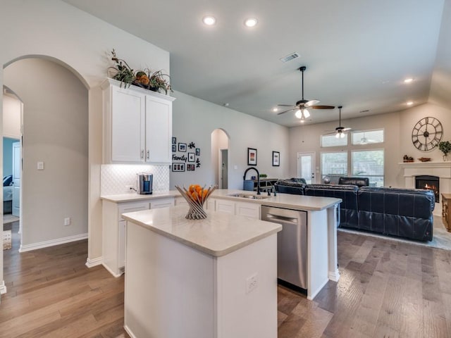 2201 Mountain Creek Ct, Wylie, TX 75098 - kitchen featuring a sink, arched walkways, dishwasher, a center island, and ceiling fan