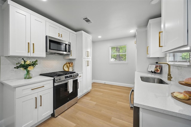 3651 Cindy Dr, Fort Worth, TX 76111 - kitchen featuring stainless steel appliances, a sink, tasteful backsplash, baseboards, and recessed lighting