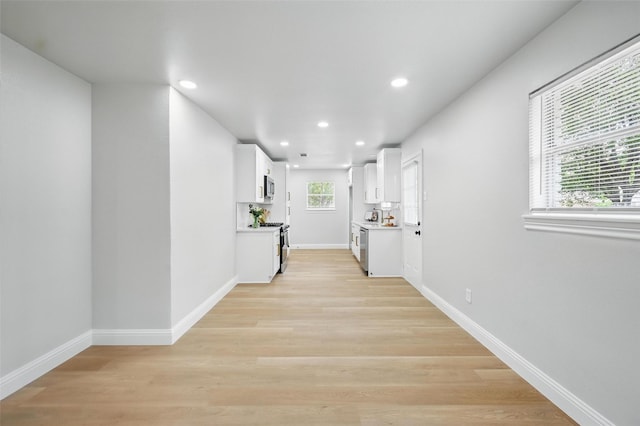 3651 Cindy Dr, Fort Worth, TX 76111 - hall with recessed lighting, light wood-type flooring, and baseboards