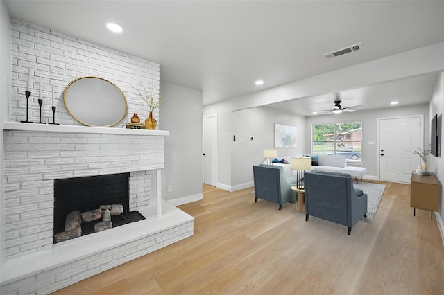 3651 Cindy Dr, Fort Worth, TX 76111 - living room featuring a ceiling fan, light wood-type flooring, baseboards, recessed lighting, and a fireplace