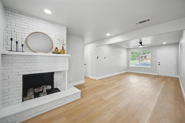 3651 Cindy Dr, Fort Worth, TX 76111 - unfurnished living room featuring baseboards, light wood-style flooring, ceiling fan, recessed lighting, and a fireplace