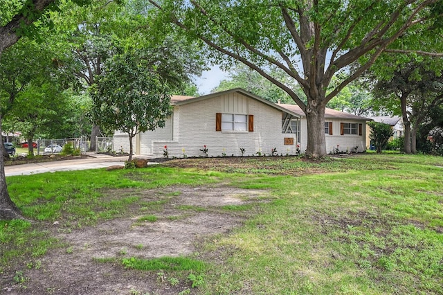 3651 Cindy Dr, Fort Worth, TX 76111 - ranch-style house featuring brick siding, driveway, and a garage