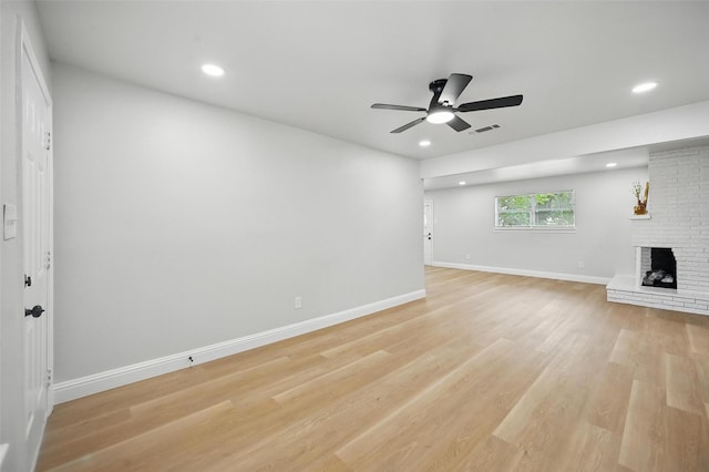 3651 Cindy Dr, Fort Worth, TX 76111 - unfurnished living room with a ceiling fan, recessed lighting, light wood finished floors, baseboards, and a brick fireplace
