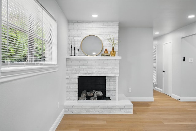 3651 Cindy Dr, Fort Worth, TX 76111 - living room featuring wood finished floors, baseboards, recessed lighting, and a brick fireplace