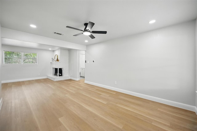 3651 Cindy Dr, Fort Worth, TX 76111 - unfurnished living room featuring a fireplace, baseboards, a ceiling fan, recessed lighting, and light wood finished floors