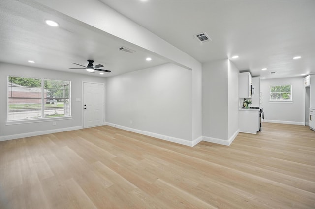 3651 Cindy Dr, Fort Worth, TX 76111 - unfurnished living room featuring baseboards, light wood-style floors, recessed lighting, and a ceiling fan