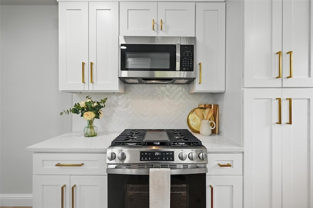 3651 Cindy Dr, Fort Worth, TX 76111 - kitchen with stainless steel appliances, tasteful backsplash, white cabinets, light stone counters, and baseboards