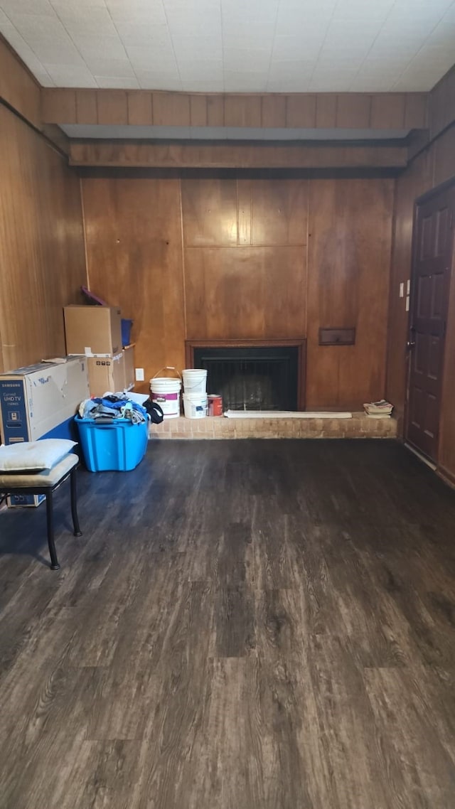 5612 Wainwright Dr, Fort Worth, TX 76112 - misc room with wood finished floors, a fireplace, and wooden walls