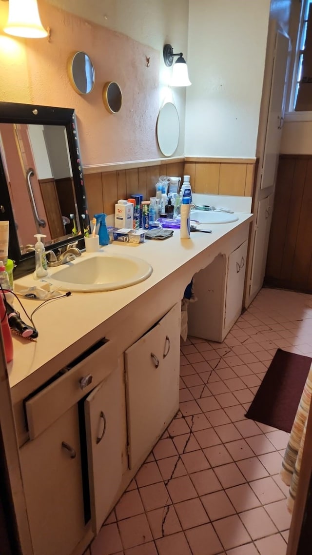 5612 Wainwright Dr, Fort Worth, TX 76112 - bathroom with a wainscoted wall, vanity, and tile patterned floors