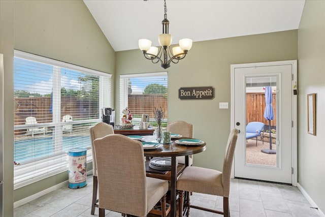 1811 Whitney Dr, Richardson, TX 75082 - dining area featuring a chandelier, vaulted ceiling, light tile patterned floors, and baseboards