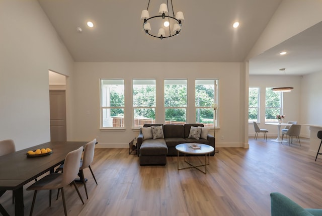 2836 Ave L, Fort Worth, TX 76105 - living area with a chandelier, recessed lighting, light wood finished floors, baseboards, and high vaulted ceiling