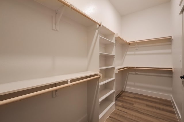 2836 Ave L, Fort Worth, TX 76105 - walk in closet featuring dark wood finished floors