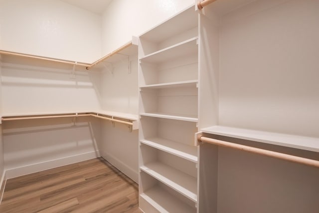 2836 Ave L, Fort Worth, TX 76105 - walk in closet with light wood-style floors