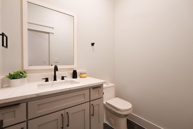 2836 Ave L, Fort Worth, TX 76105 - bathroom with toilet, vanity, and baseboards