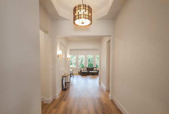 2836 Ave L, Fort Worth, TX 76105 - hall featuring light wood finished floors, a chandelier, and baseboards