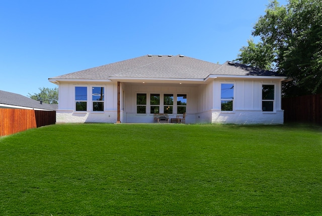 2836 Ave L, Fort Worth, TX 76105 - back of house featuring a shingled roof, brick siding, and board and batten siding