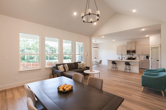 2836 Ave L, Fort Worth, TX 76105 - living room featuring a chandelier, light wood finished floors, high vaulted ceiling, recessed lighting, and baseboards