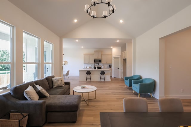 2836 Ave L, Fort Worth, TX 76105 - living area with a chandelier, light wood-style flooring, recessed lighting, baseboards, and high vaulted ceiling