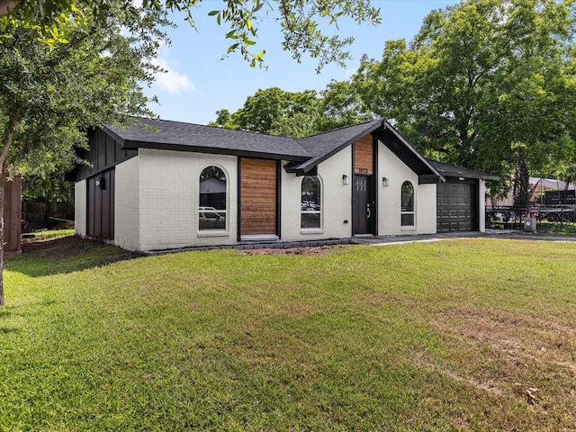 1013 Nueva Tierra St, Grand Prairie, TX 75052 - mid-century home featuring brick siding, an attached garage, a shingled roof, and driveway