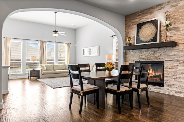 1020 Highpoint Way, Roanoke, TX 76262 - dining room with arched walkways, ceiling fan, wood finished floors, and healthy amount of natural light