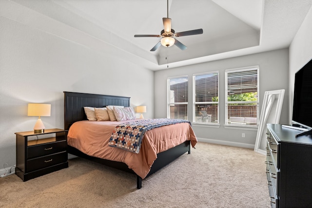 1020 Highpoint Way, Roanoke, TX 76262 - bedroom featuring a tray ceiling, light carpet, baseboards, and ceiling fan
