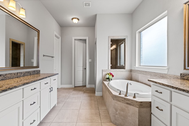 1020 Highpoint Way, Roanoke, TX 76262 - bathroom featuring a garden tub, vanity, tile patterned flooring, and baseboards