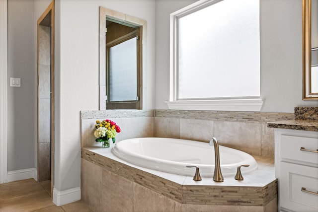 1020 Highpoint Way, Roanoke, TX 76262 - bathroom featuring a bath, vanity, and baseboards
