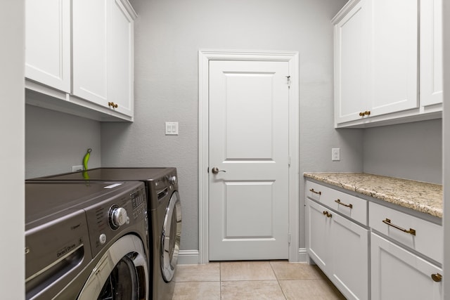 1020 Highpoint Way, Roanoke, TX 76262 - laundry room with washer and dryer, cabinet space, light tile patterned flooring, and baseboards