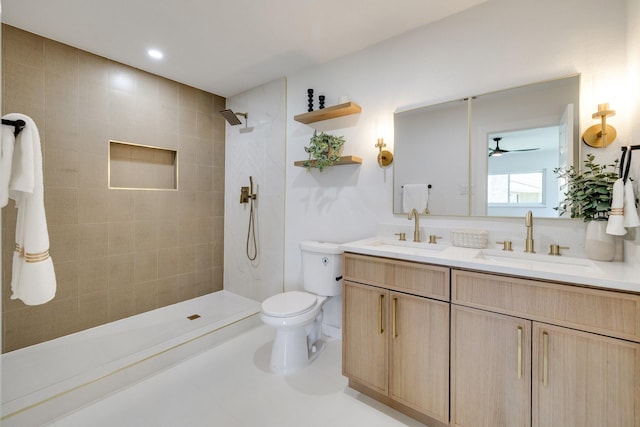 4128 Blackwillow Dr, Mesquite, TX 75150 - bathroom with double vanity, a tile shower, toilet, and ceiling fan