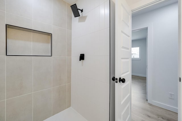 4128 Blackwillow Dr, Mesquite, TX 75150 - full bathroom featuring a tile shower, baseboards, and wood finished floors
