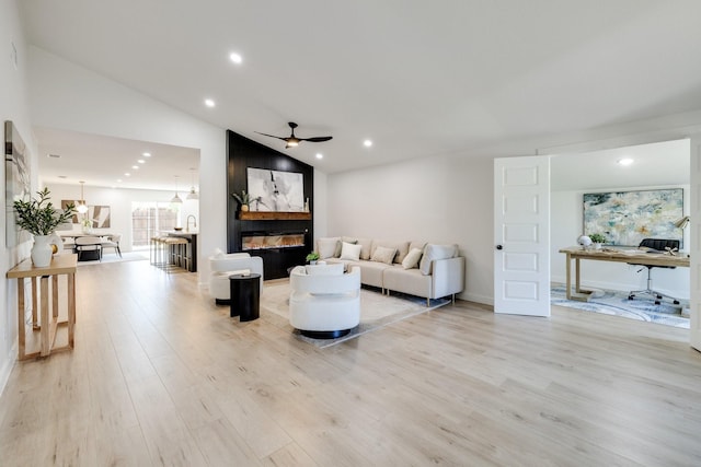 4128 Blackwillow Dr, Mesquite, TX 75150 - living area featuring a ceiling fan, light wood-style flooring, an office area, recessed lighting, and a large fireplace