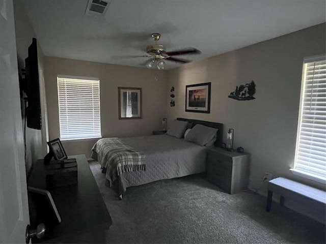609 S 3rd St, Sanger, TX 76266 - bedroom featuring carpet floors, multiple windows, and a ceiling fan