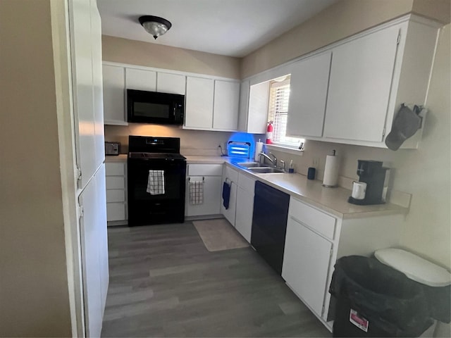 609 S 3rd St, Sanger, TX 76266 - kitchen featuring black appliances, a sink, white cabinetry, light countertops, and light wood-style floors