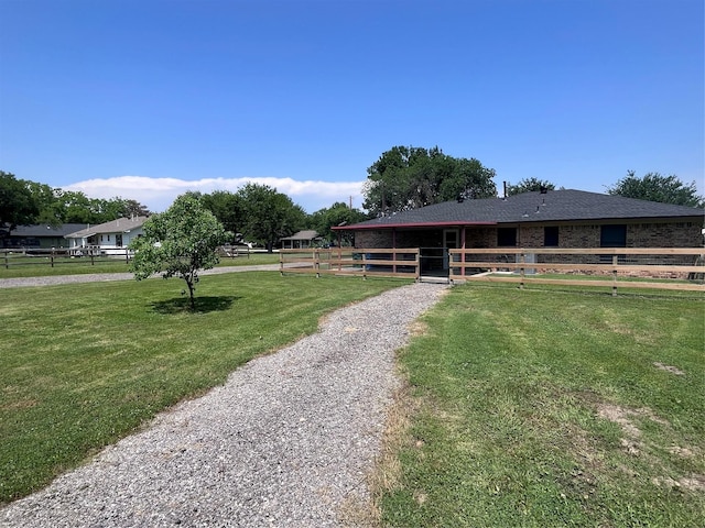 609 S 3rd St, Sanger, TX 76266 - view of front of house featuring an exterior structure and an outdoor structure
