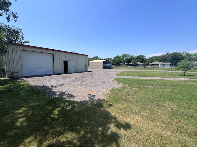 609 S 3rd St, Sanger, TX 76266 - view of yard with an outbuilding, a detached garage, and driveway