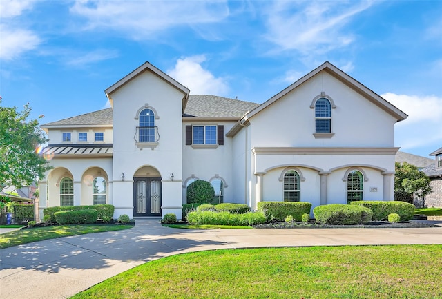 1070 Great Meadow Dr, Allen, TX 75013 - mediterranean / spanish house with a standing seam roof, stucco siding, and french doors
