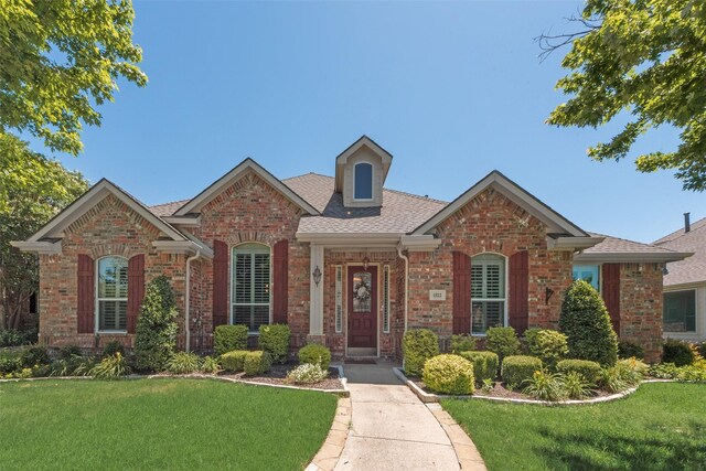1522 Farm Dl, Allen, TX 75002 - view of front of property featuring brick siding, a front yard, and roof with shingles