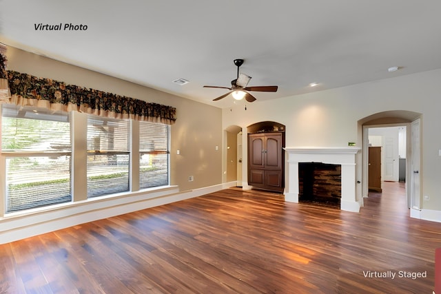 1522 Farm Dl, Allen, TX 75002 - unfurnished living room featuring arched walkways, ceiling fan, and wood finished floors