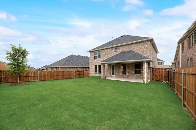 3229 Loftwood Ln, Anna, TX 75409 - rear view of house featuring brick siding, a patio area, a fenced backyard, and roof with shingles