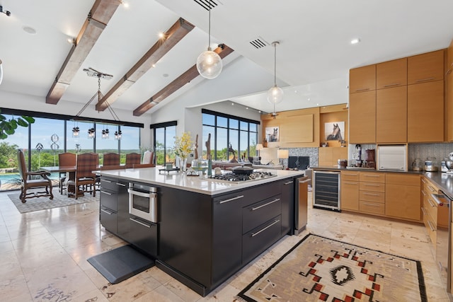2333 County Road 163, Stephenville, TX 76401 - kitchen with beverage cooler, tasteful backsplash, hanging light fixtures, a large island, and modern cabinets