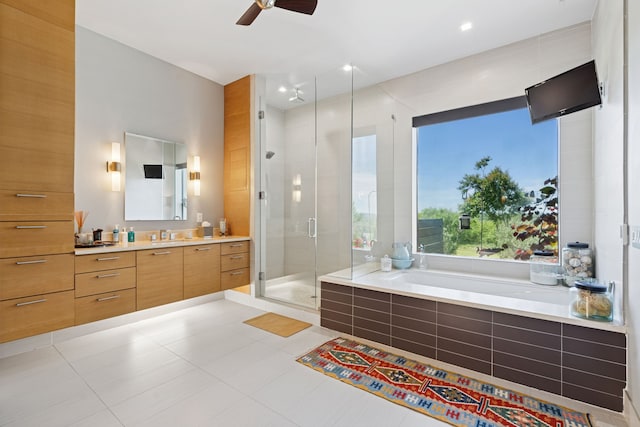 2333 County Road 163, Stephenville, TX 76401 - full bathroom with vanity, a stall shower, a bath, a ceiling fan, and tile patterned flooring