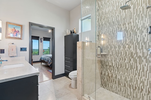 2333 County Road 163, Stephenville, TX 76401 - ensuite bathroom with vanity, a shower stall, toilet, and tile patterned floors