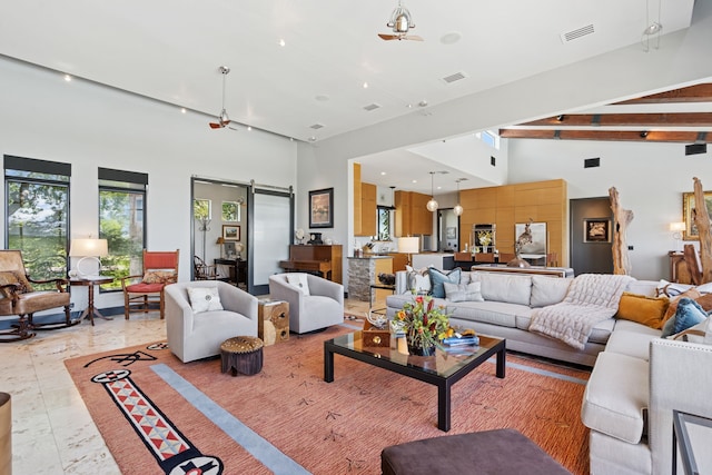 2333 County Road 163, Stephenville, TX 76401 - living room with a towering ceiling, a barn door, and beamed ceiling