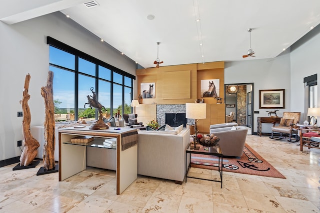2333 County Road 163, Stephenville, TX 76401 - living area with a high ceiling and a premium fireplace