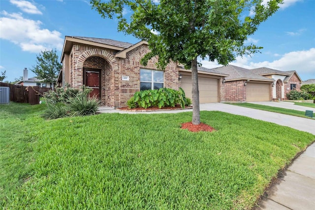 409 Hoover Ave, Lavon, TX 75166 - view of front facade featuring brick siding, concrete driveway, a garage, and roof with shingles