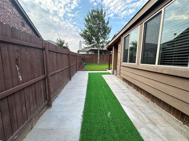 409 Hoover Ave, Lavon, TX 75166 - fenced backyard featuring a patio area