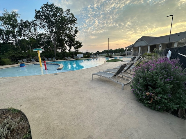 409 Hoover Ave, Lavon, TX 75166 - pool at dusk featuring a patio area and a community pool